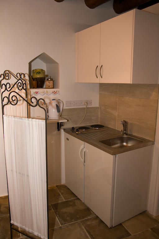 Xenios Cottages Lofou Quarto foto